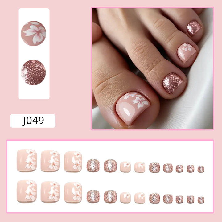 Fingernail art set with elegant floral design and glitter accents Stornfield