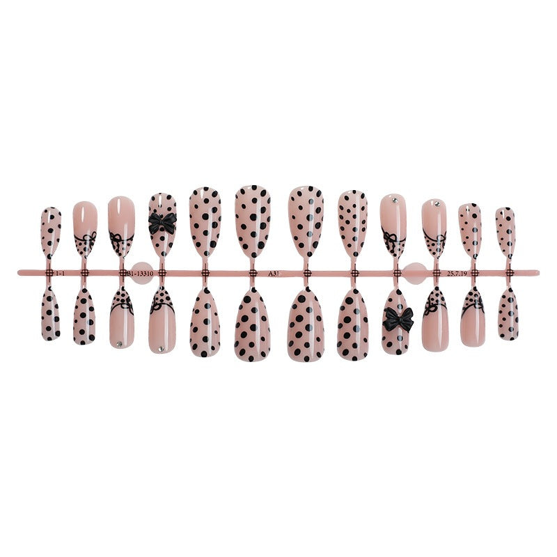 Nail art set with elegant polka dot and bow motifs Stornfield