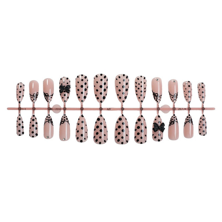 Nail art set with elegant polka dot and bow motifs Stornfield