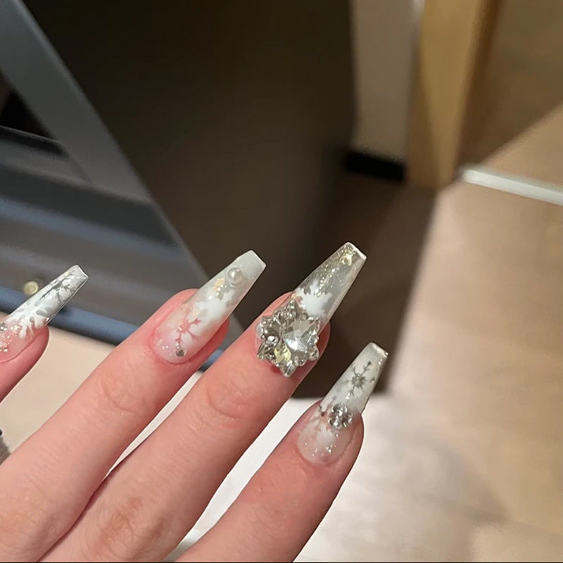 Artificial nail set with frosty snowflake design and sparkling 3D applications Stornfield