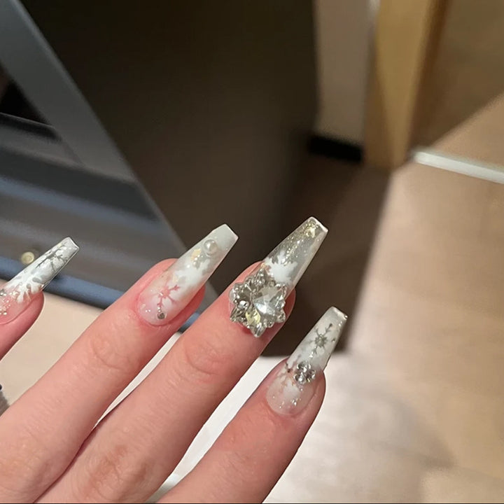 Artificial nail set with frosty snowflake design and sparkling 3D applications Stornfield