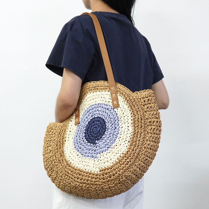 Braided basket bag with unique round design and elegant shoulder straps Stornfield