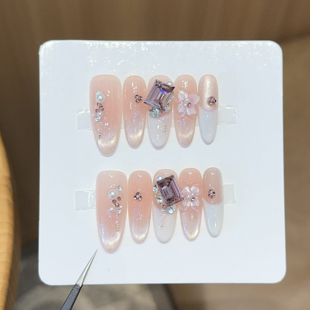 Artificial nails with elegant jewelry details Stornfield