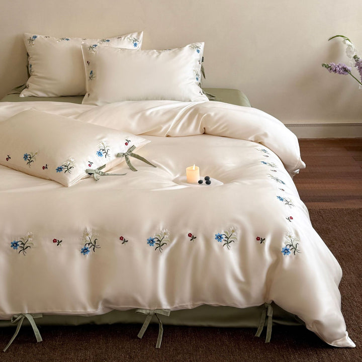 Luxurious satin bedding with floral embroidery and bow closure