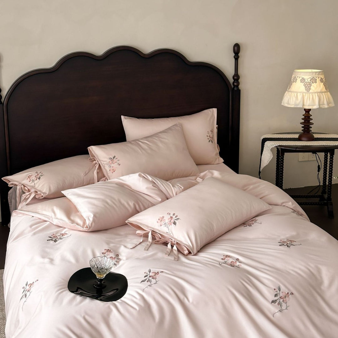 Satin bed cover set with embroidered rose branches, bow ties and silky-matte finish