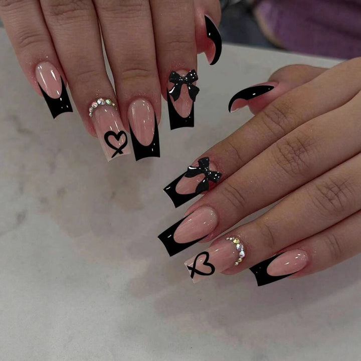 Acrylic nail set with elegant heart and bow design Stornfield