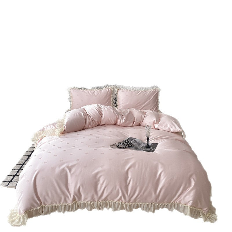 Elegant reversible bedding with romantic ruffle trim and subtle polka dot relief