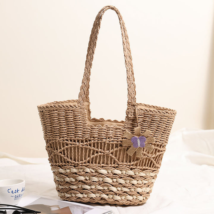 Braided basket bag with decorative flower appliqué Stornfield