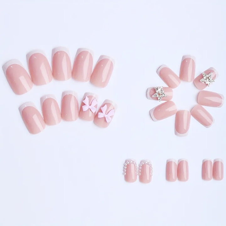 Artificial nail tips with glamorous bow and rhinestone design Stornfield
