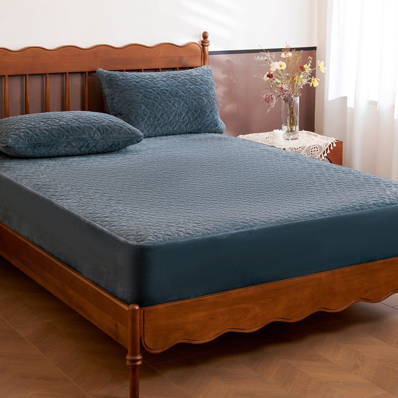 Quilted mattress protector with non-slip bottom and soft microfiber cover