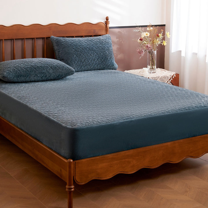 Quilted mattress protector with non-slip bottom and soft microfiber cover