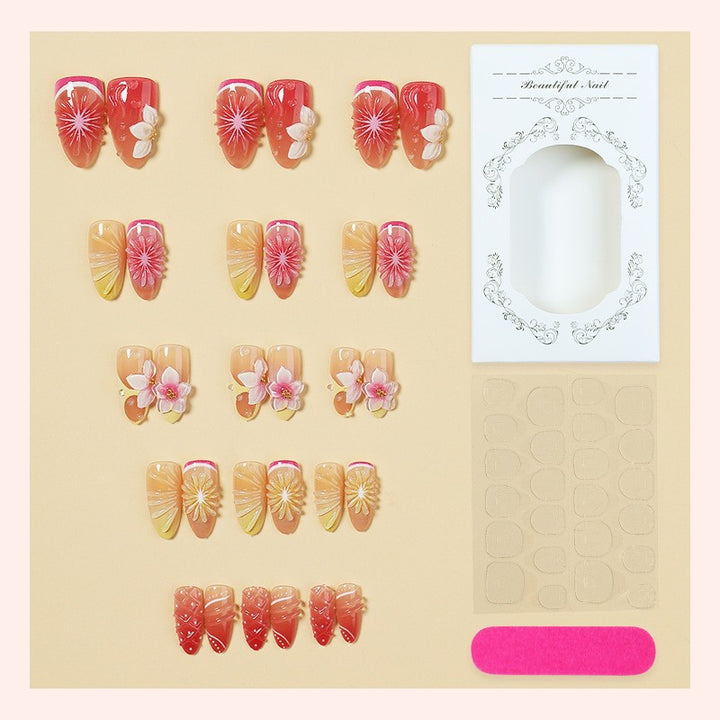 Artificial nail set with elegant floral details and glitter effects Stornfield