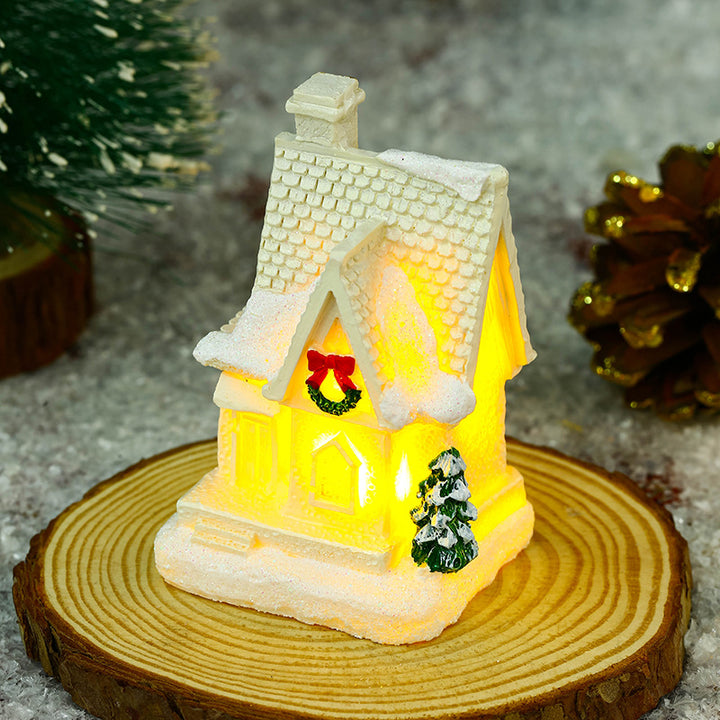 Illuminated Christmas village house with festive decoration Stornfield