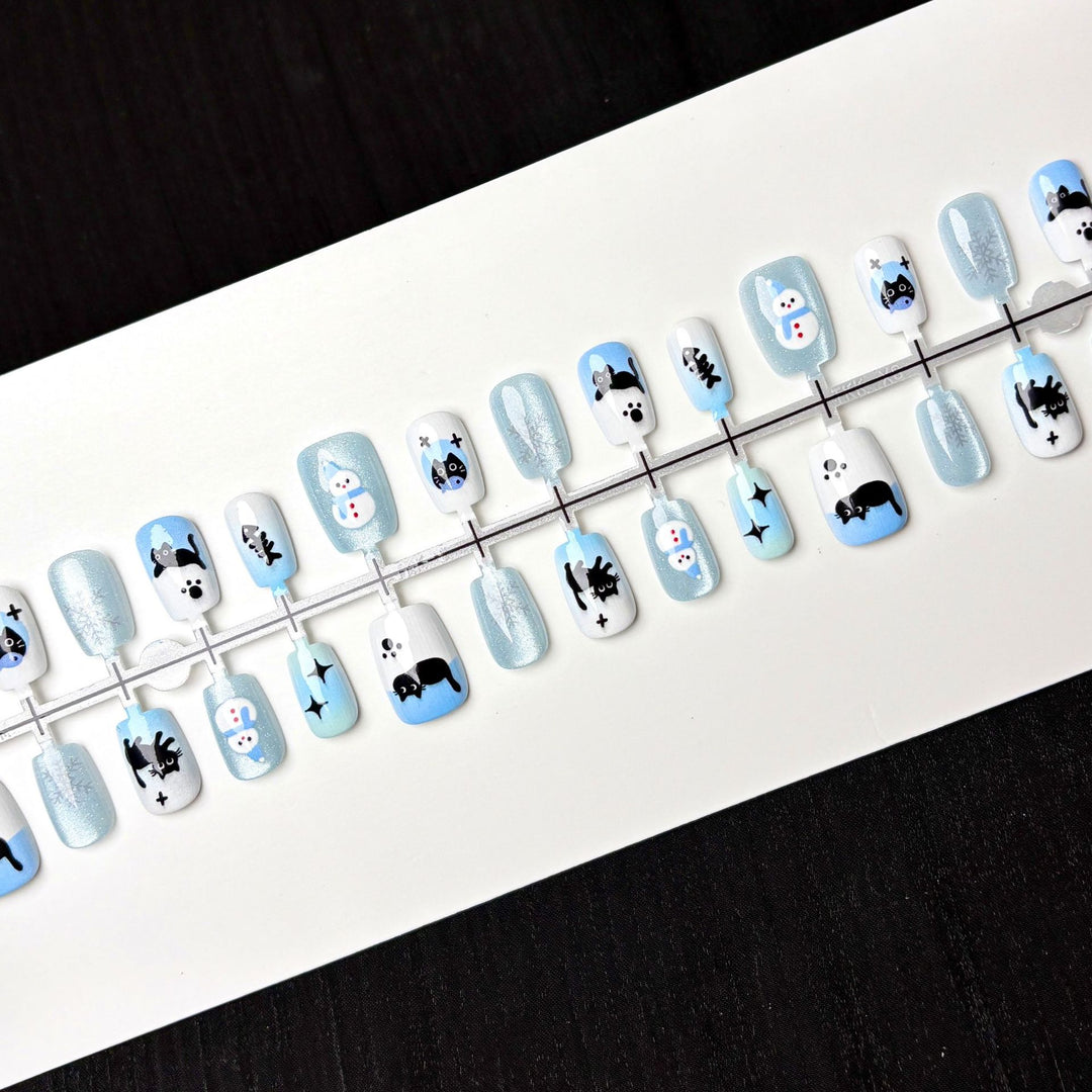 Themed Press-On Nail Art Set with Winter Illustrations