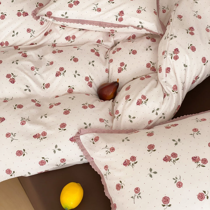 Finely woven cotton percale bedding set with delicate floral print and crocheted lace edge