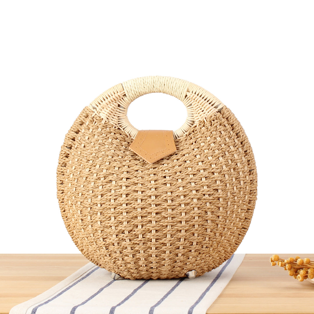 Round straw bag with elegant leather handle Stornfield