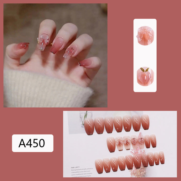 Artificial nails with heart accent and glamorous decorations Stornfield