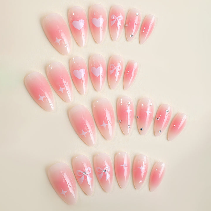 Acrylic nail set with romantic heart and bow design Stornfield