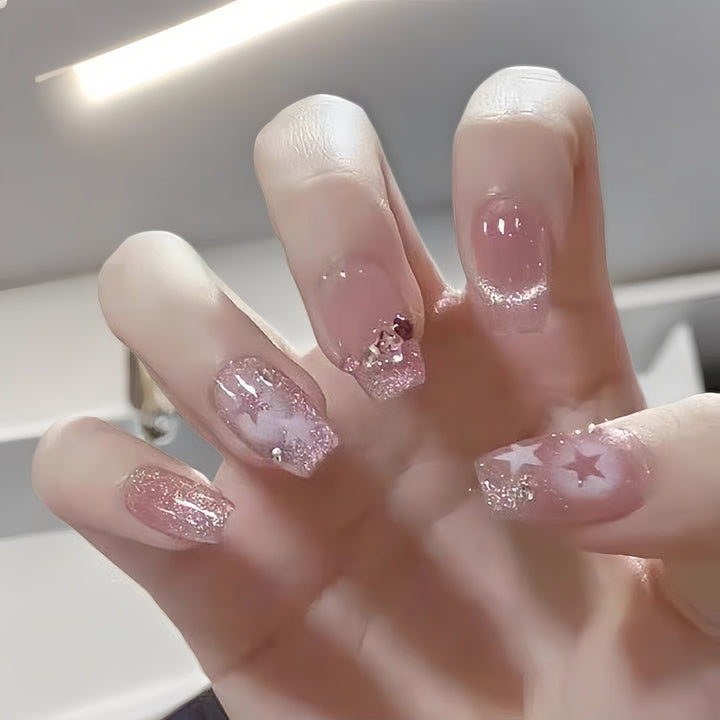 Glamorous artificial nails with delicate flower and glitter effects Stornfield