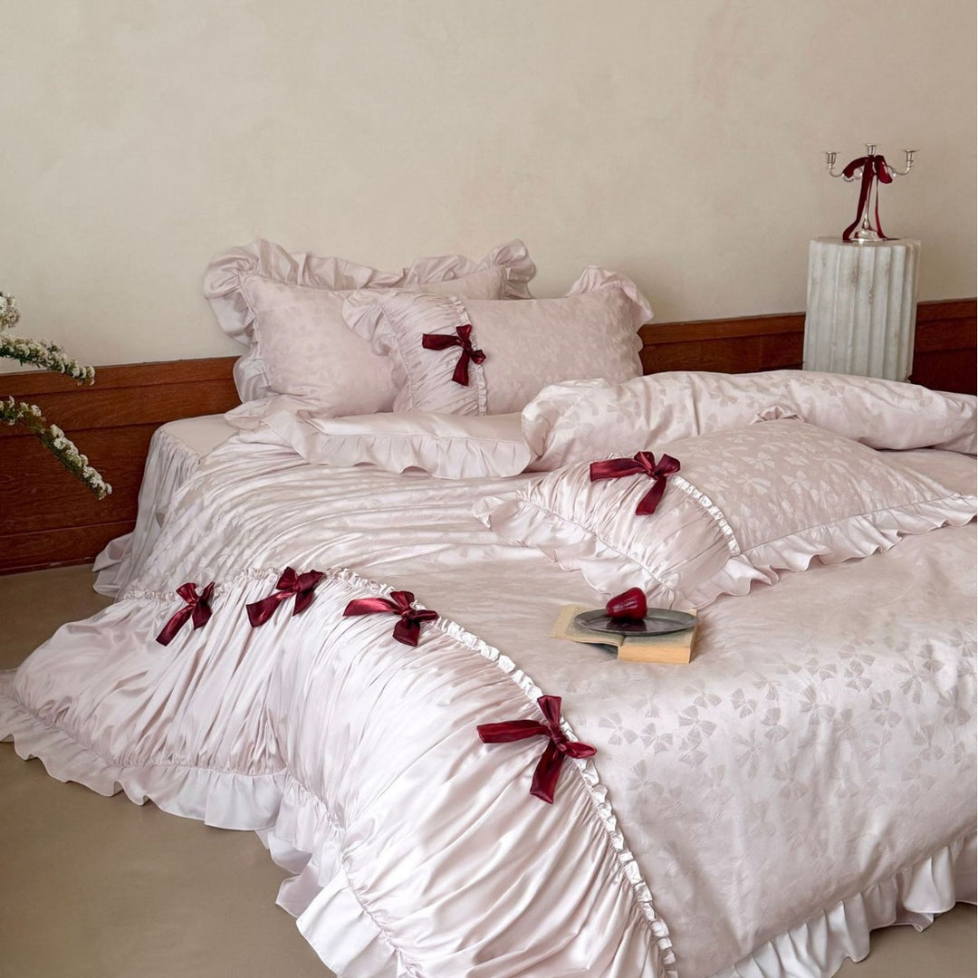 Luxurious satin bedding set with ruffles and decorative bows
