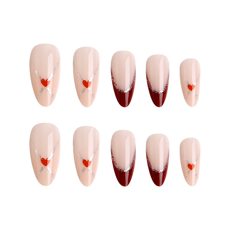 Acrylic nails with heart motifs and glitter details Stornfield