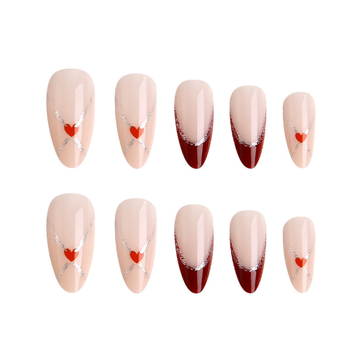Acrylic nails with heart motifs and glitter details Stornfield