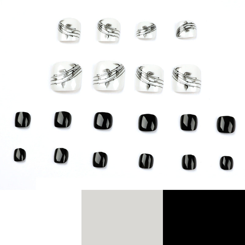 Artful toenail art in elegant black and white design Stornfield