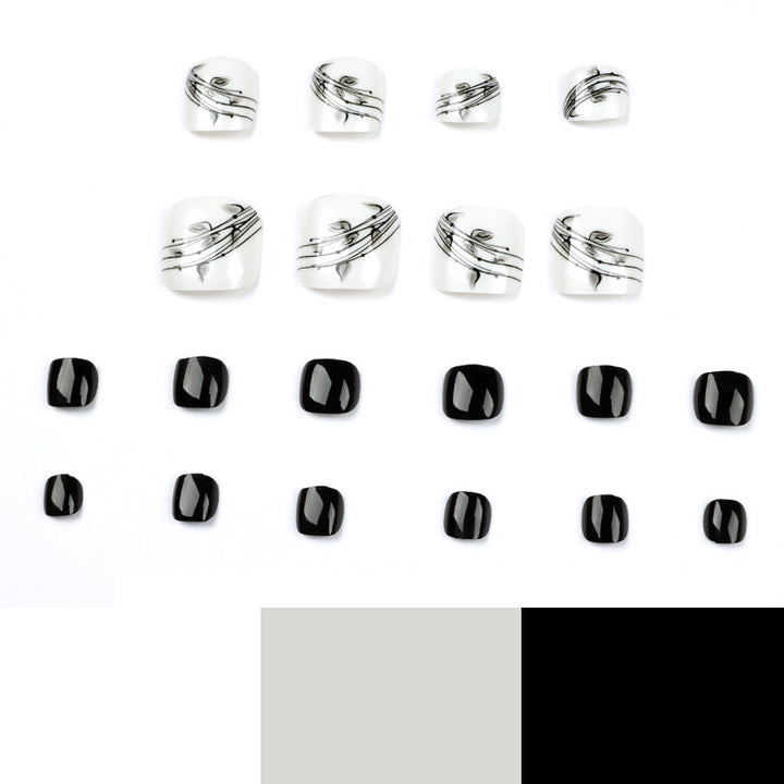 Artful toenail art in elegant black and white design Stornfield