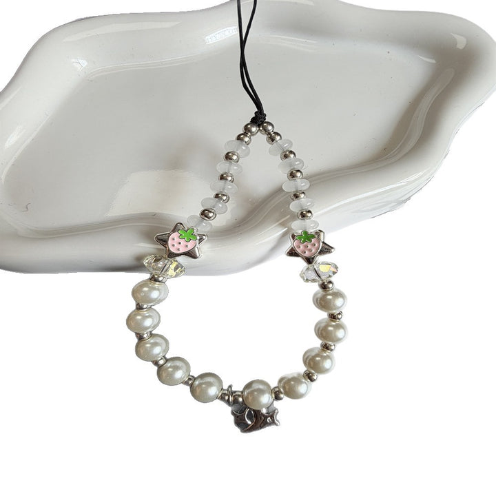 Playful Pearl and Charm Exaggerated Necklace Stornfield