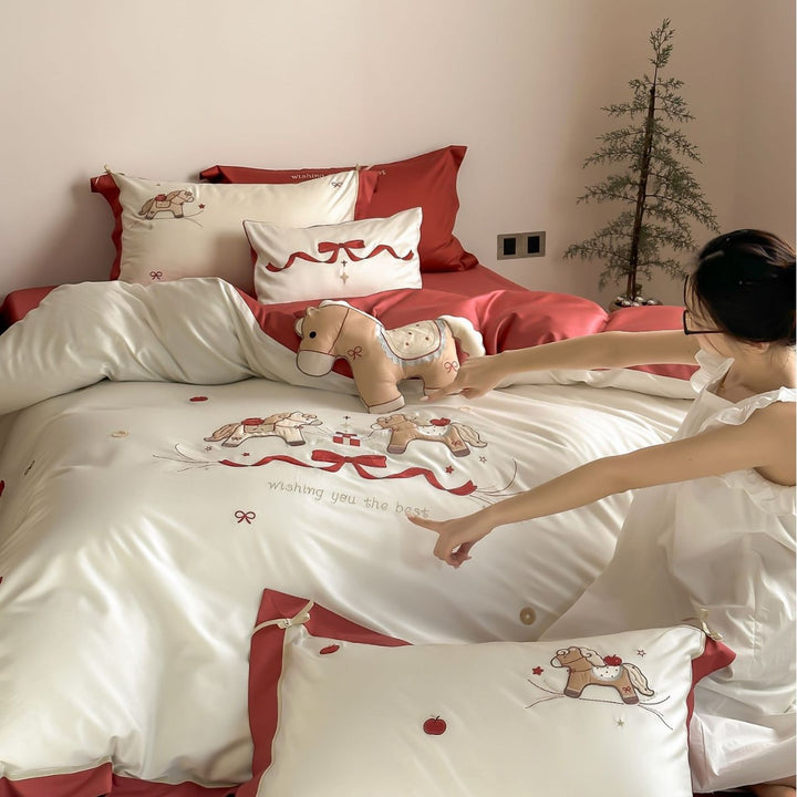 Satin bedding set with embroidered rocking horse motif
