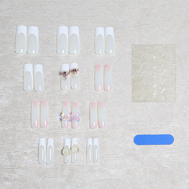 Artificial nails with delicate embellishments Stornfield