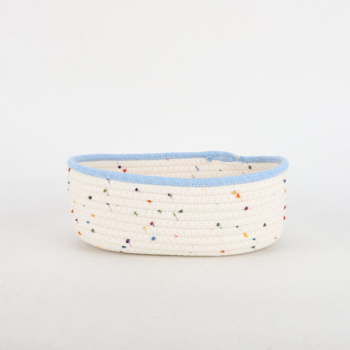 Storage basket made of natural cotton fabric with colorful dots