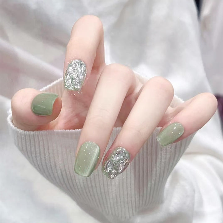 Acrylic nail set with elegant glitter design and creative effects Stornfield