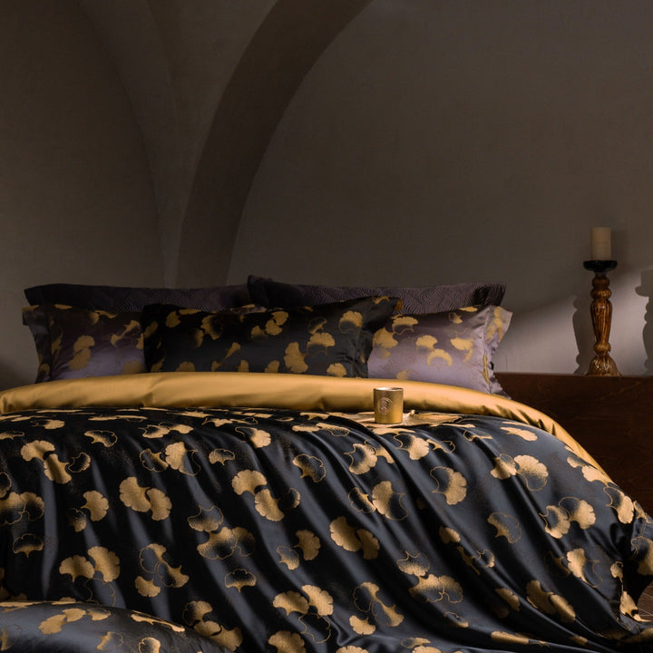 Luxurious satin bedding set with jacquard lace pattern and decorative pillow