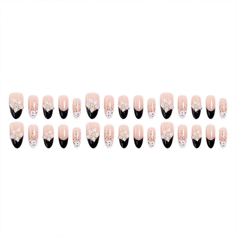 Artful nail tips with floral embellishments Stornfield