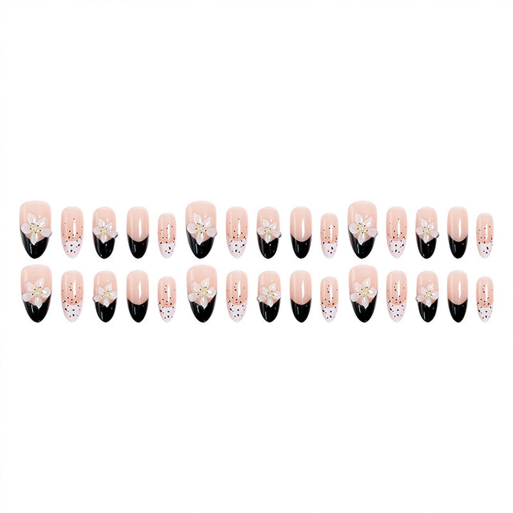 Artful nail tips with floral embellishments Stornfield