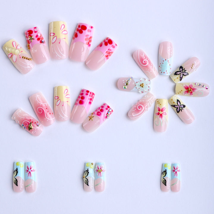 Artistic nails with floral accents and glitter clusters Stornfield