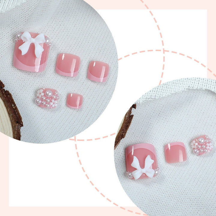 Artificial nail set with romantic bow design Stornfield