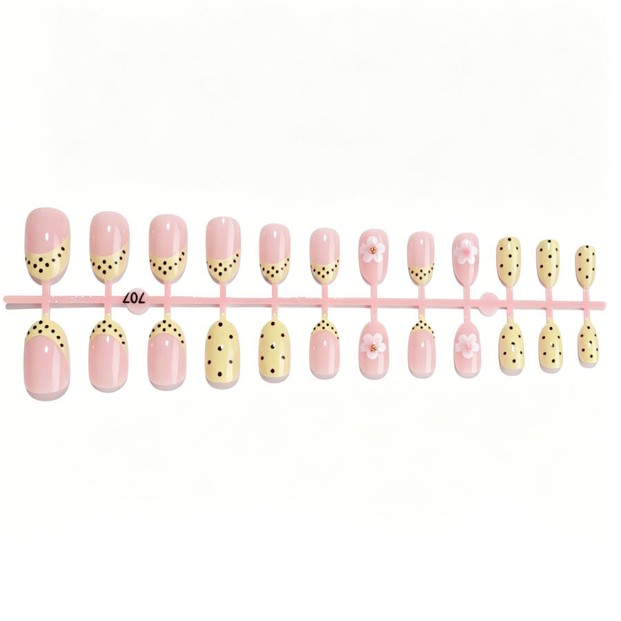 Artificial nail set with a cheerful floral design and elegant accents Stornfield