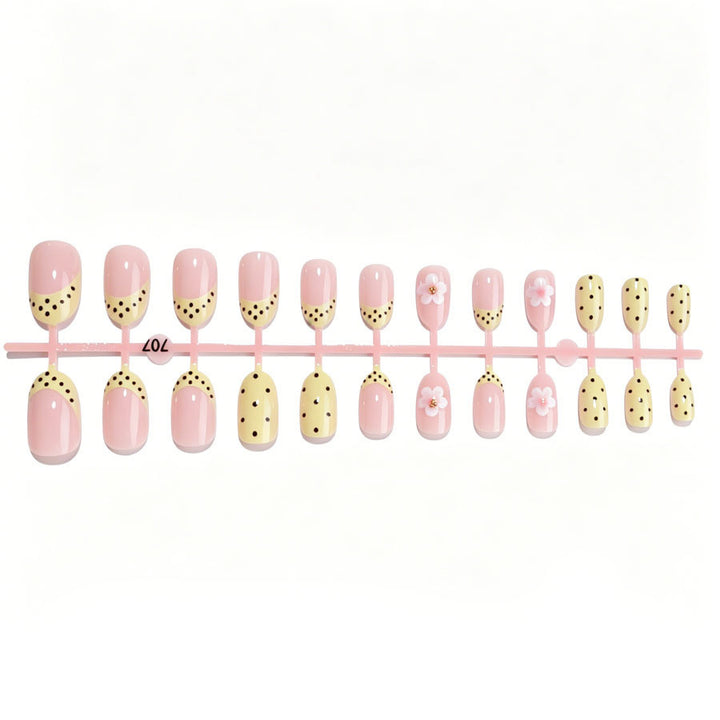 Artificial nail set with a cheerful floral design and elegant accents Stornfield