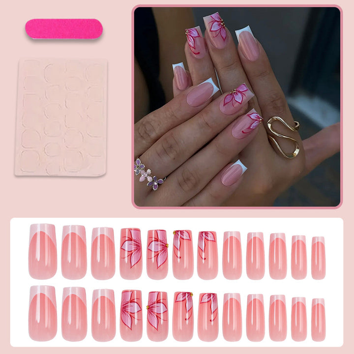 Artificial nail set with elegant flower designs and glitter accents Stornfield