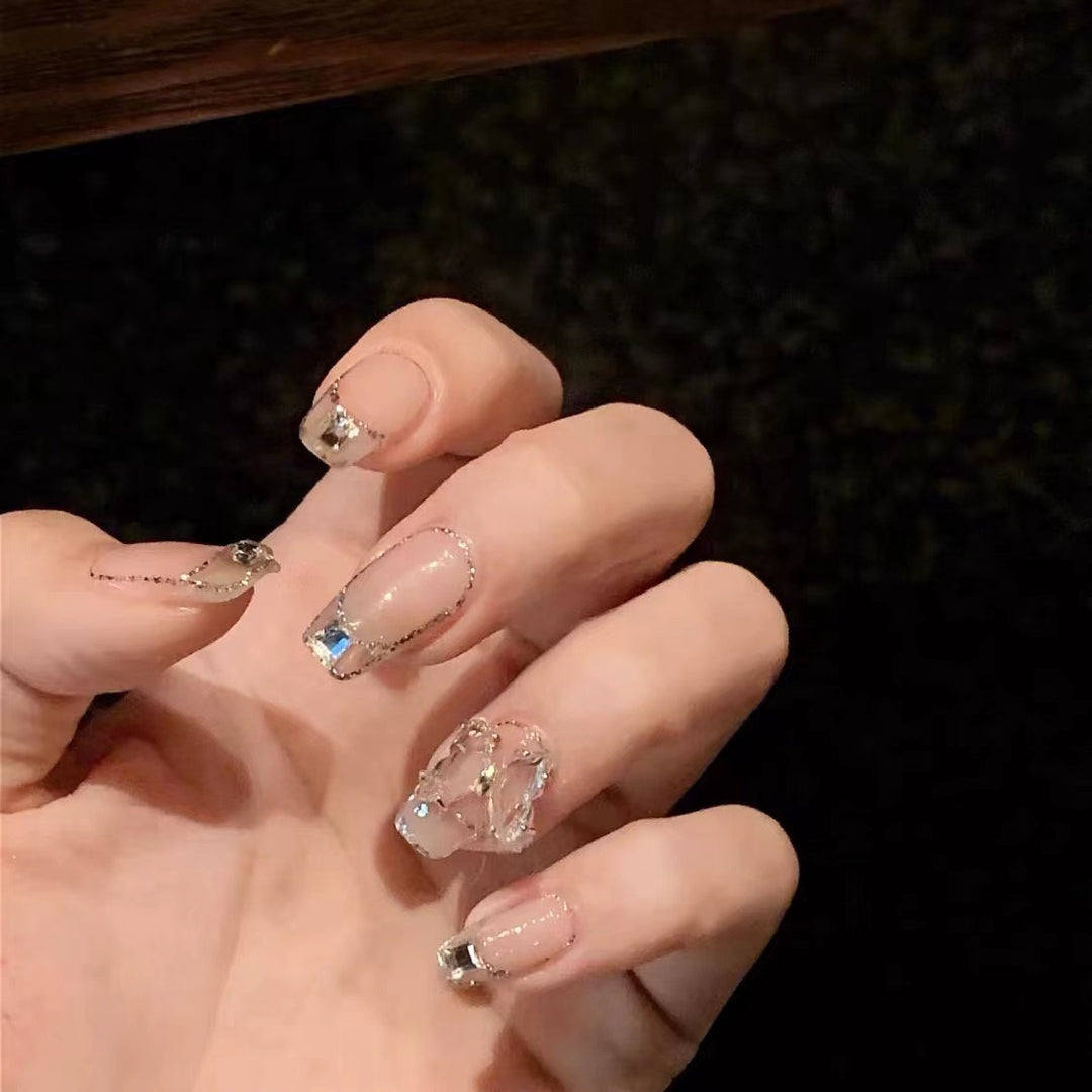 Glamorous artificial nails with delicate rhinestone decorations Stornfield