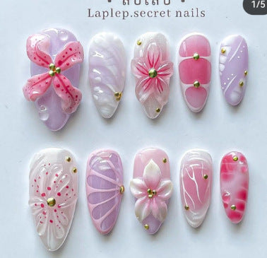 Artificial nail set with floral decorations and delicate glitter Stornfield