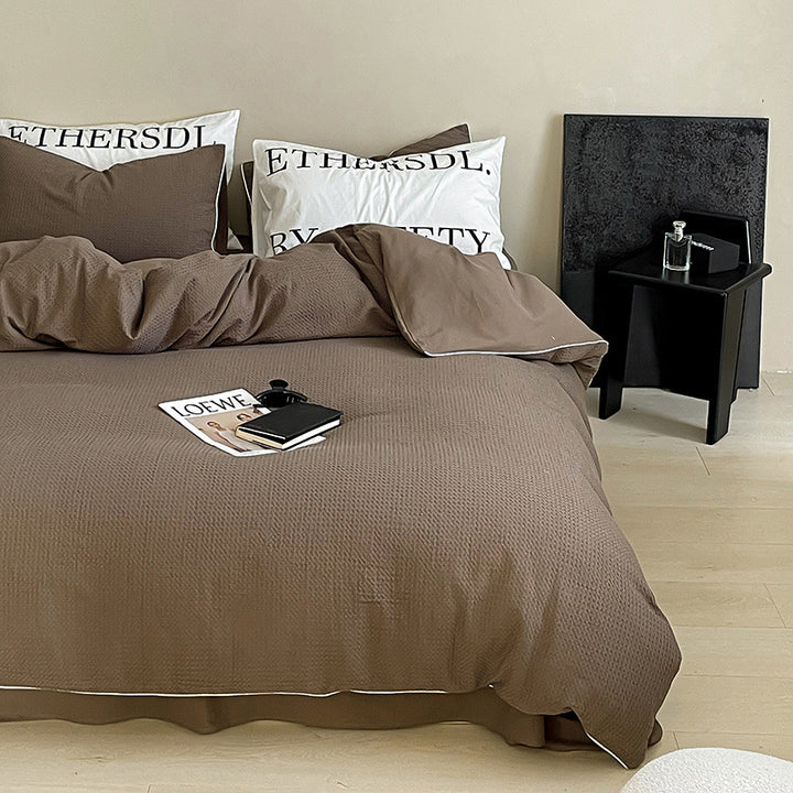Textured cotton waffle duvet cover with pillowcases and fine contrasting piping