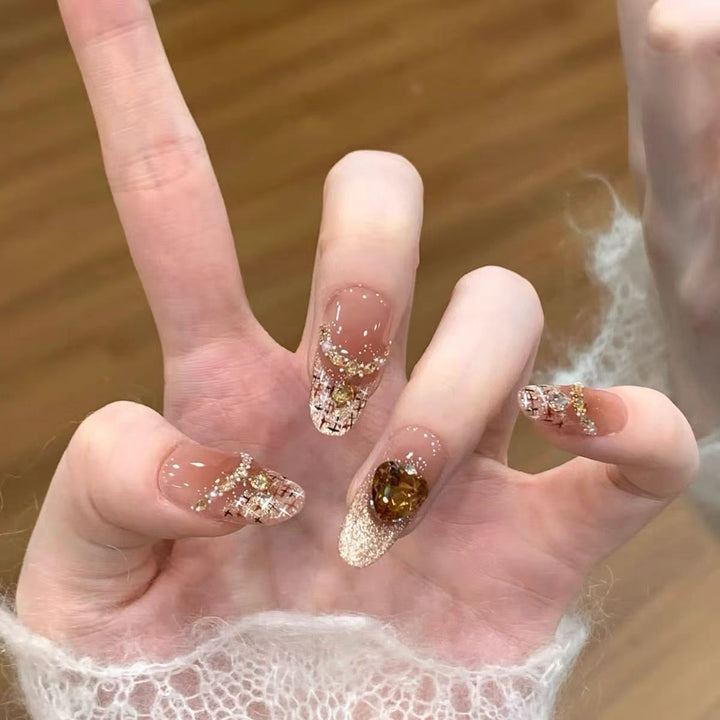 Artificial nails with glitter and heart accents Stornfield