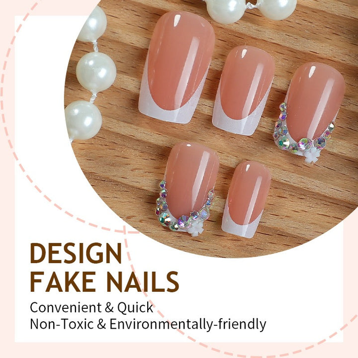 Nail art set with delicate flower and glitter accents Stornfield