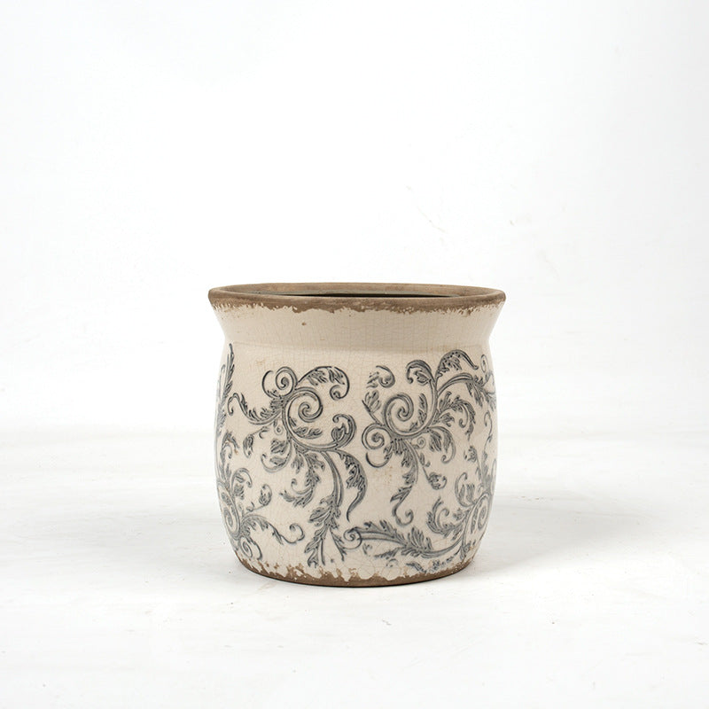 Decorative ceramic plant container with artistic design Stornfield