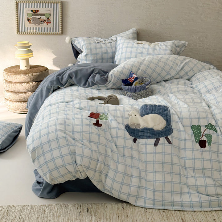 Plush bedding set with embroidered dog motif and striped cuddle blanket
