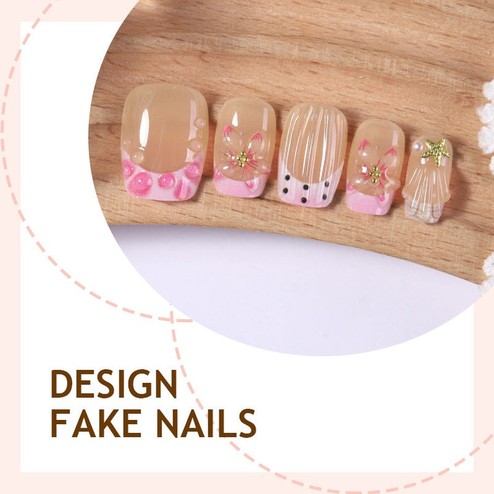Artificial nail set with floral designs and elegant glitter elements Stornfield