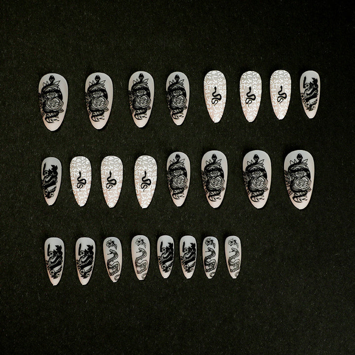 Artful nail extensions in elegant stiletto style with artistic floral and graphic designs Stornfield